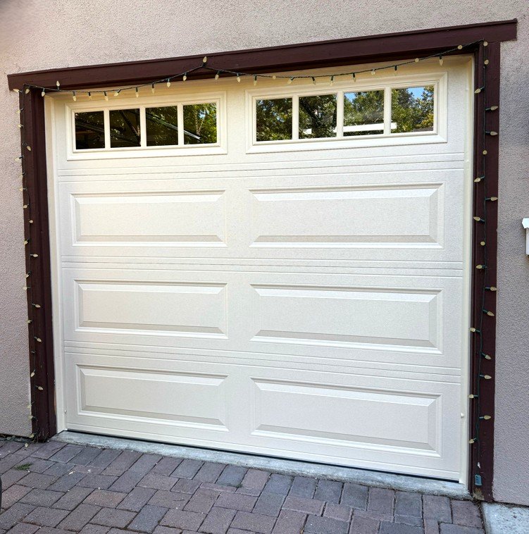 Classic white raised-panel Amarr garage door installation
